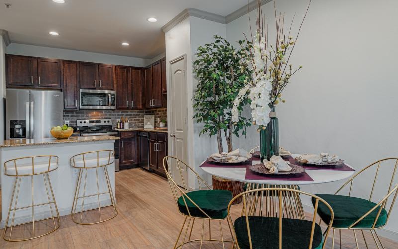a kitchen with a table and chairs